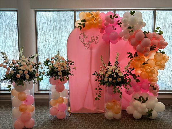 Baby shower balloon and floral backdrop